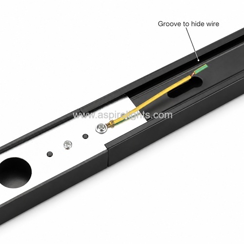 Black track light rail with groove to hide wire