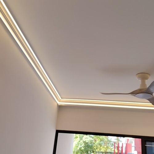 Coveless cove light installed at ceiling edge in Singapore condo living room
