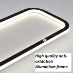 Close up view of a modern slim rectangle ceiling light showcasing its sleek black frame trim and perimeter light diffusers.