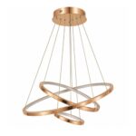 Rose gold triple ring pendant light installed above a marble dining table
