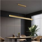 Architectural long rectangle gold LED hanging light with remote styled over an upscale minimalist dining table.