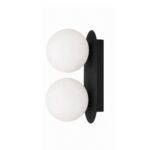 Matte black double globe wall sconce mounted on a white wall with light-diffusing frosted glass orbs.