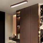 Modern walnut ceiling light above bedroom wardrobe