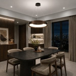 Walnut ring pendant light above a dining table at night