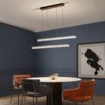 Luxury minimalist crystal chandelier above round dining table