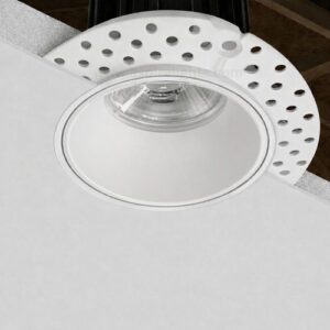Before and after plaster installation of a trimless recessed downlight for false ceiling