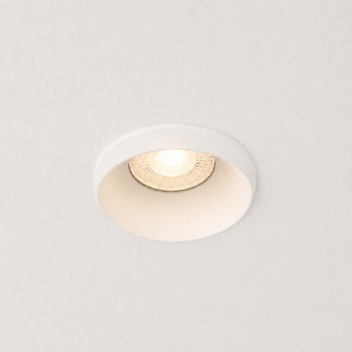Small round fixed recessed downlight in singapore home lit on false ceiling with warm anti-glare glow